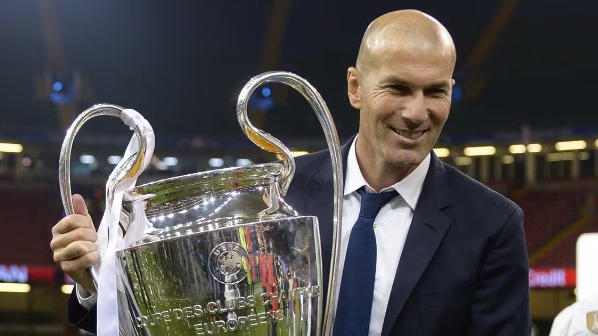 Zidane poses with the Champions League trophy