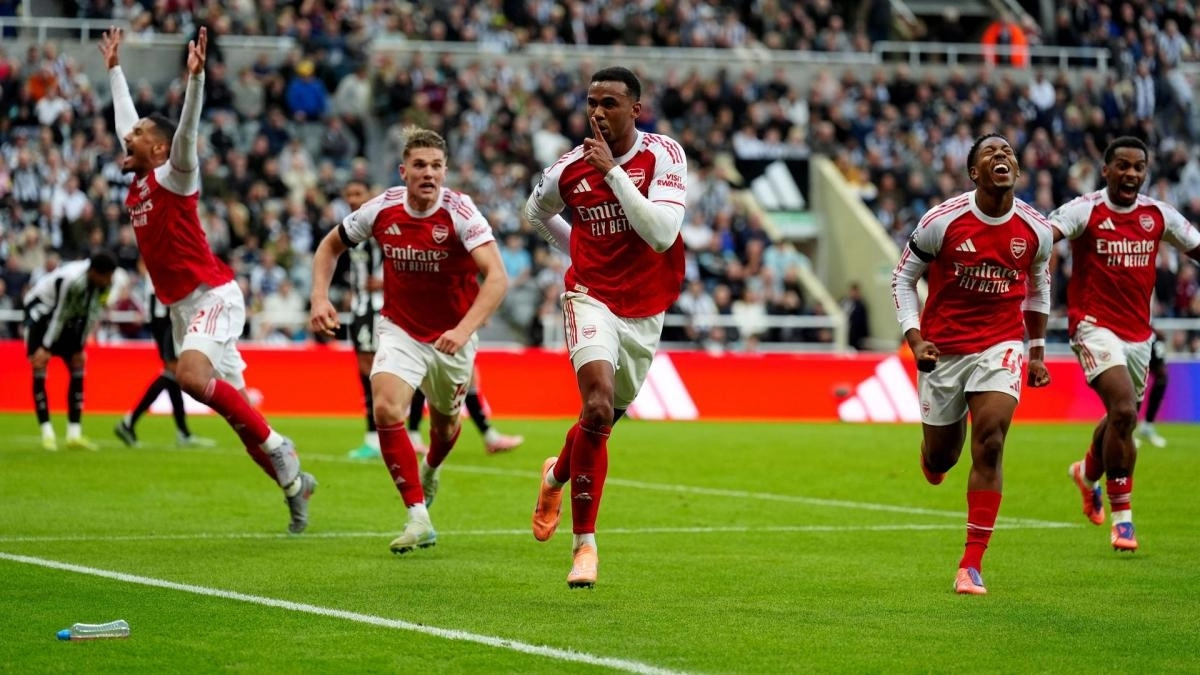 Arsenal players celebrate a goal.