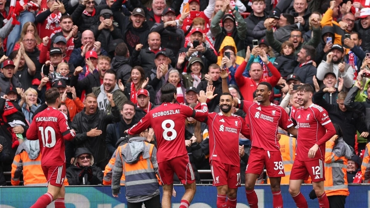 The Liverpool players celebrate a goal.