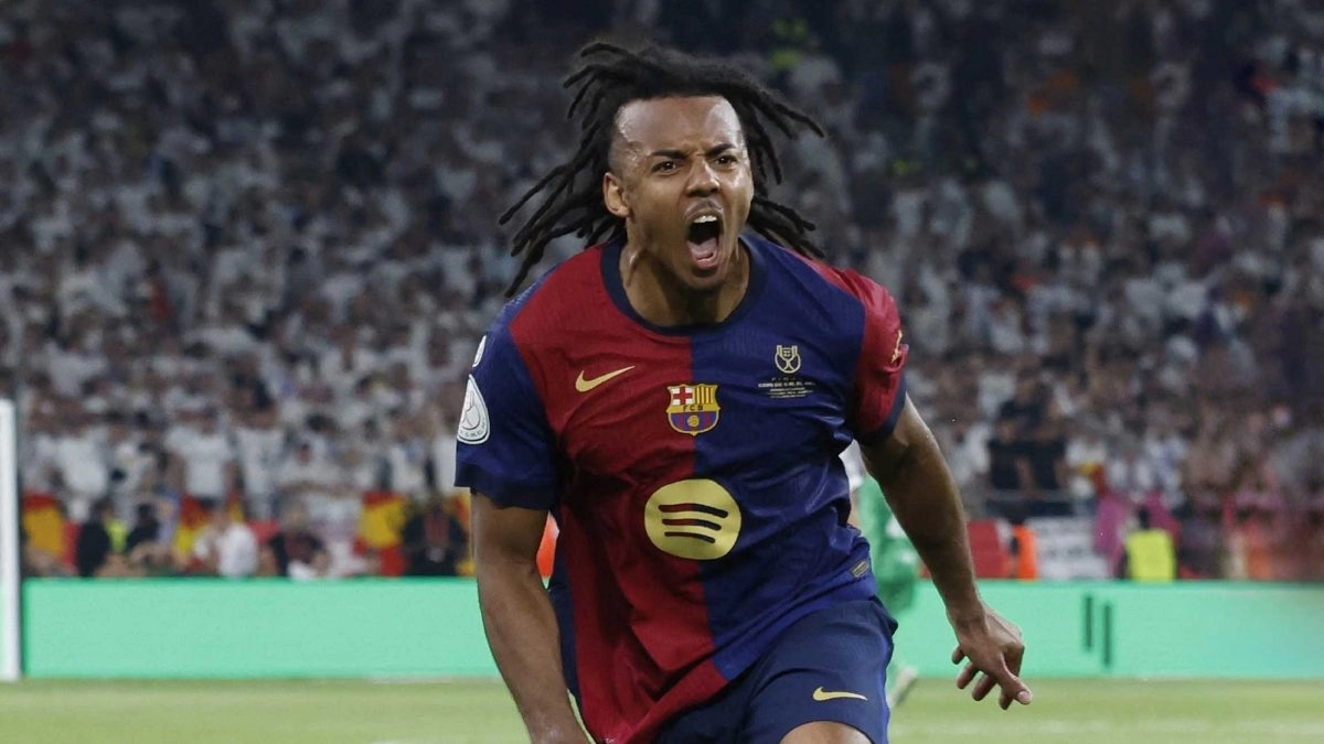 <p>Jules Koundé celebrates a goal scored with Barcelona</p>