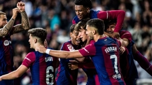 The Barcelona players celebrate a goal.