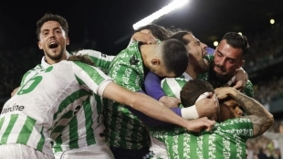 Real Betis players celebrate a goal.